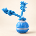 Blue WiggleChase toy with a ribbed ball and two knotted rope ends on an ivory background.